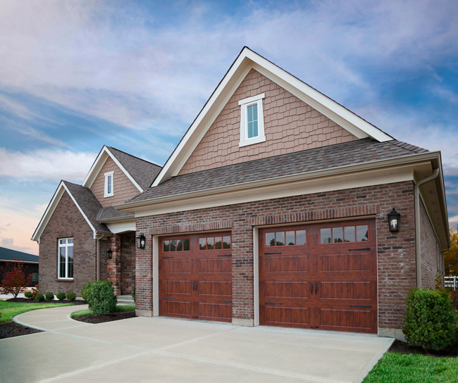 steel garage doors with faux wood tone look